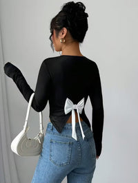 Long-Sleeve Black Top With Contrast White Oversized Bow